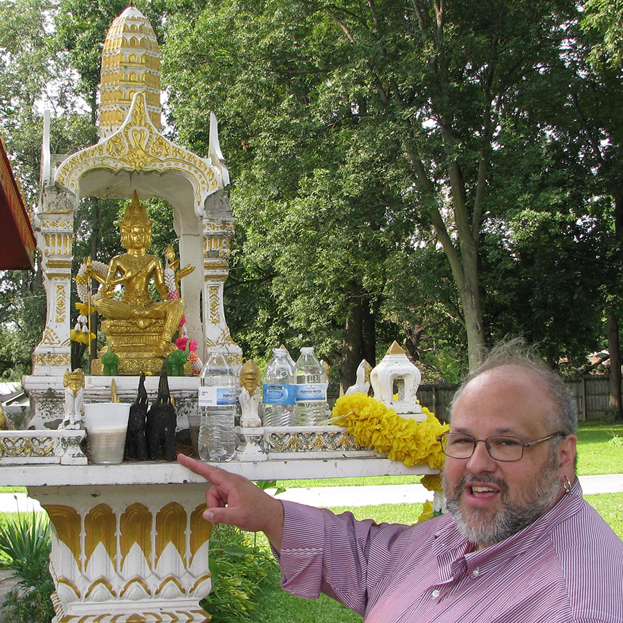 Faculty member showing a shrine