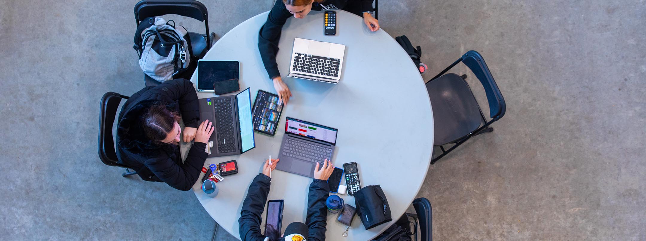 group of students around a circular table